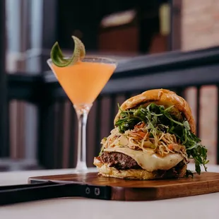 a burger and a cocktail