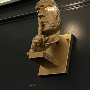 The sconces want to keep this gem a secret!