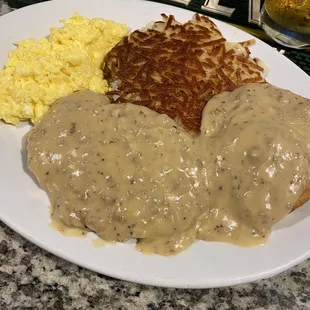 Country fried steak, biscuit &amp;gravy and hash browns and scrambled eggs
