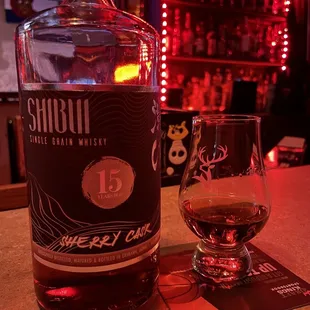 a bottle of whiskey and a glass