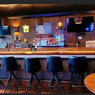 a bar with stools