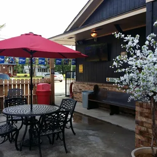 a patio with tables and chairs