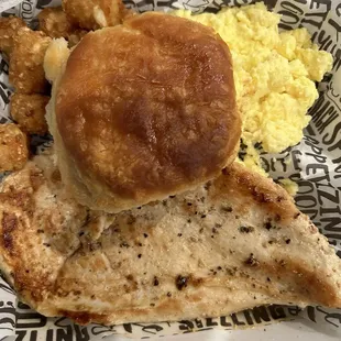 WOW breakfast of scrambled eggs, tots, biscuit and a very large chicken breast! YUM