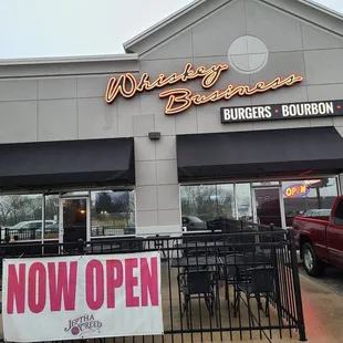 a sign in front of a restaurant
