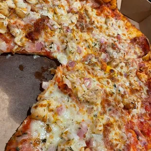 a half eaten pizza in a box