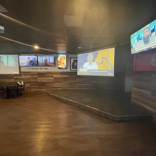 a bar with multiple screens