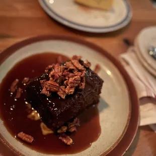 Whiskey cake with pumpkin cheesecake in the background