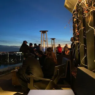 Rooftop bar on the water with heaters