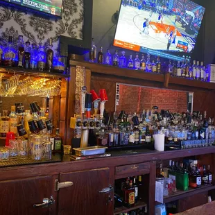 a bar filled with liquor bottles