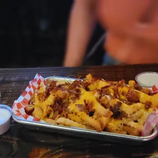 a tray of fries and a glass of water