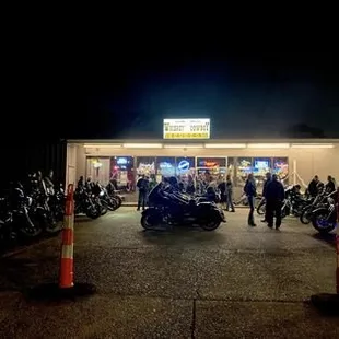 motorcycles parked outside at night