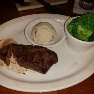 The original 8oz Whiskey Creek flat iron steak w/ 2 sides $15.99