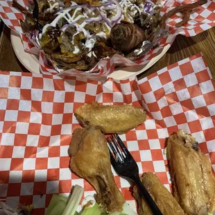 chicken wings, celery, and a salad