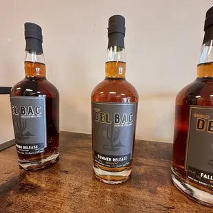 three bottles on a table