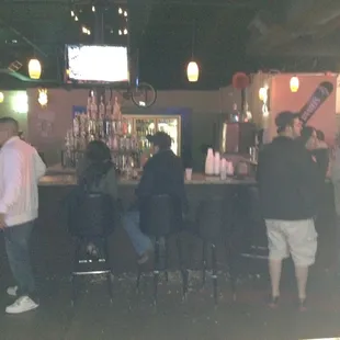 a group of people at a bar