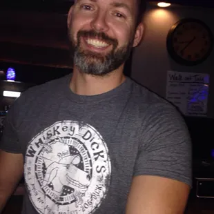 One of many fun and friendly bartenders at this bar. Come have a great time. They&apos;re awesome hosts!