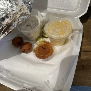 The sides for the Memphis plate 2 hush puppies with side of mac and cheese and potato salad