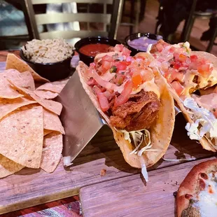 tacos and chips on a wooden table