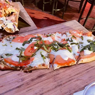 a pizza on a wooden board