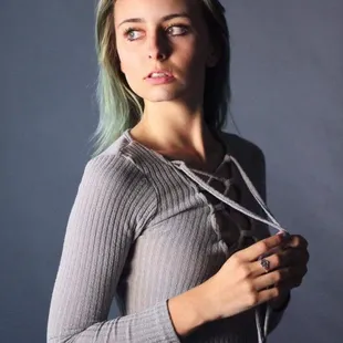 a young woman with green hair