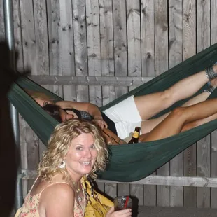 a woman laying in a hammock