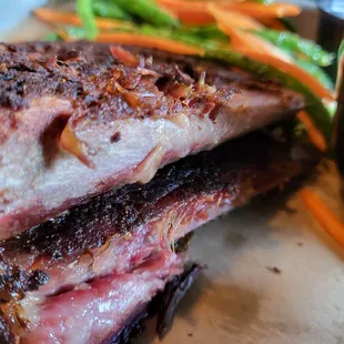 a plate of meat and vegetables