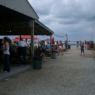 Patio bar is on the left, indoor bar and seating on the right, as is the music stage.  The water is directly ahead in this photo.