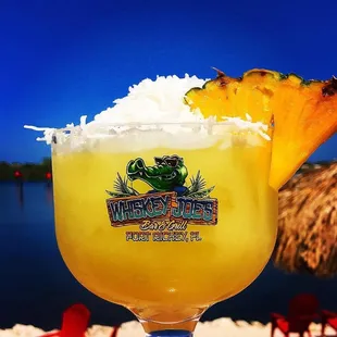 Coconut Margarita served in a souvenir cup