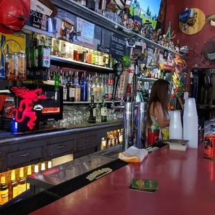 a woman behind the bar