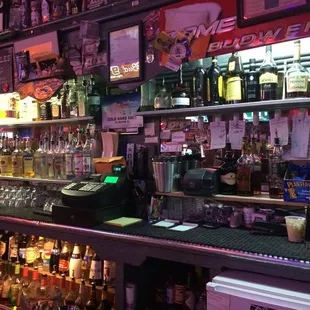 Behind the bar.