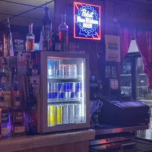a bar with neon signs