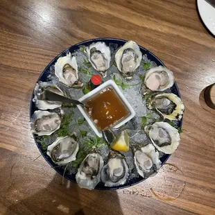 Here with my beautiful wife, again, 13 days later. In the photo are higata oysters on half shell. Delicious.