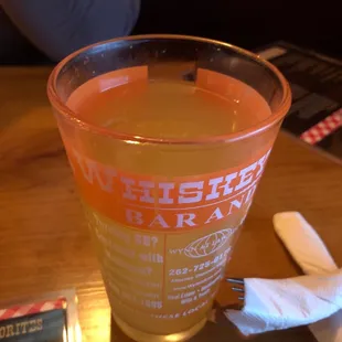 a pint glass with a drink in it