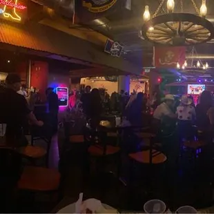 a crowd of people at a bar
