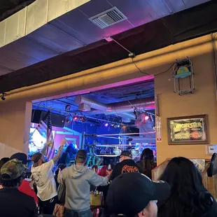 a crowd of people at a bar