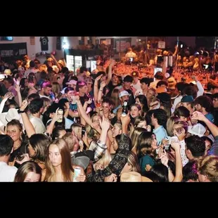 a large crowd of people at a party