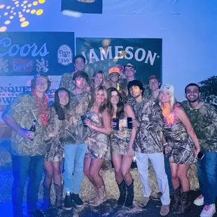 a group of people dressed in camo