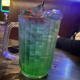 a green drink in a glass