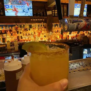 a person holding a drink