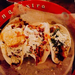 From left to right-breakfast taco, korean taco, and pineapple shrimp taco