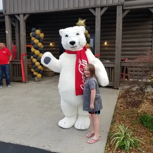 My daughter with the coke a cola bear.