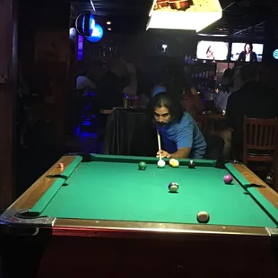 a man playing pool