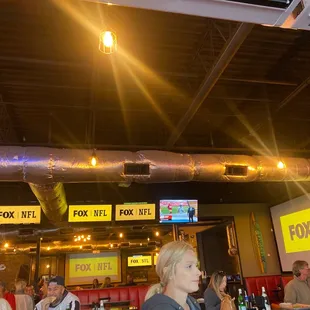 a group of people sitting at a bar