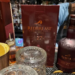 a bottle of redbreast and glasses