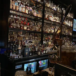a bar filled with liquor bottles