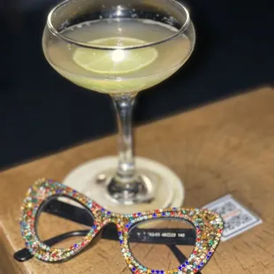 a martini and a pair of glasses