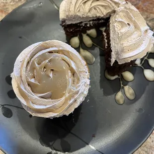 a chocolate cupcake with frosting