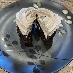 a chocolate cupcake with frosting