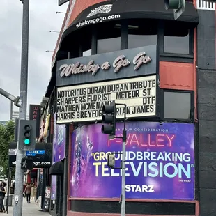 a street corner with a movie theater