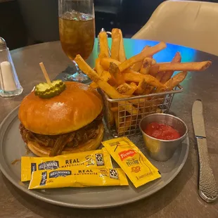 BBQ Brisket sandwich!! So full of meat it kept Falling out onto my plate. I am definitely and pleasantly stuffed.